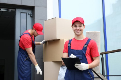 Movers carrying furniture from a central London flat