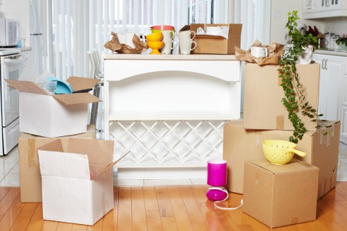 Removal professionals transporting office items through a Paddington building