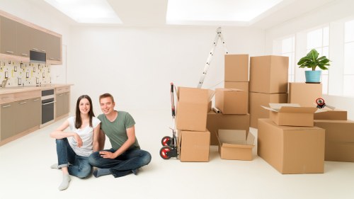 Furniture and boxes being handled in a Paddington apartment move
