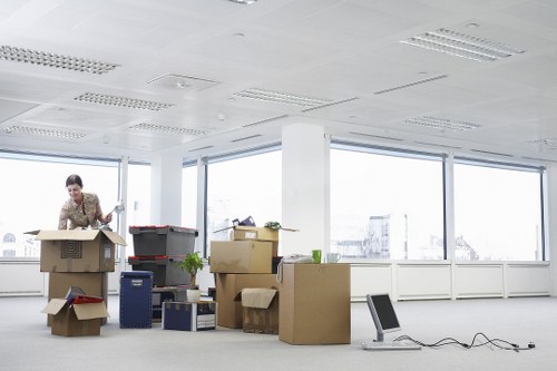 Packed office furniture and equipment ready for a Paddington business move