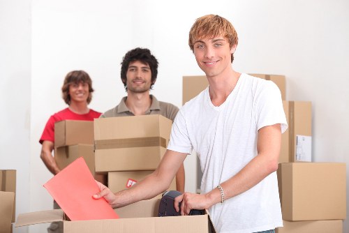 Trained mover preparing furniture for transport with care
