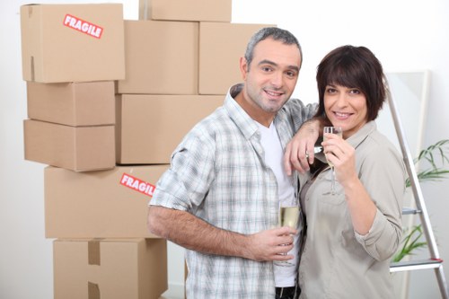 Professional house movers loading items into a truck in Paddington
